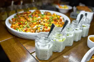 Buffet Table with Variety of Foods and Sauces