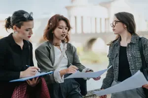 Three Women Discussing Business Plans
