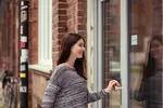 Woman entering a door