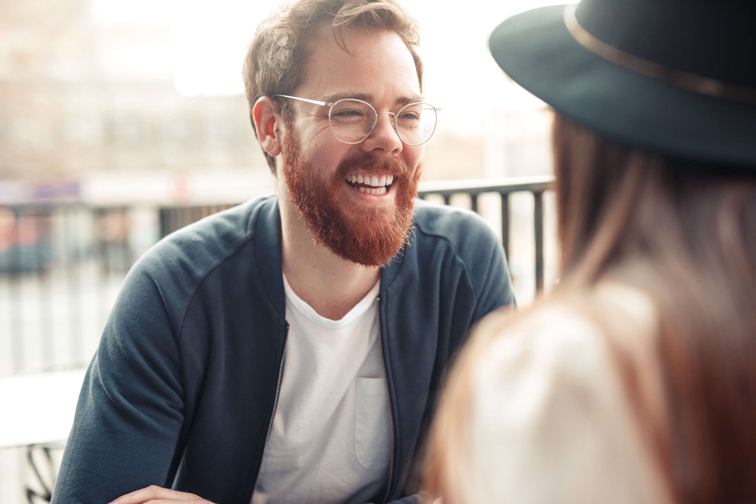 Man Laughing with a Friend