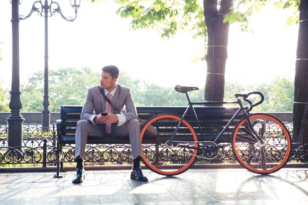 Man Sitting on a Bench