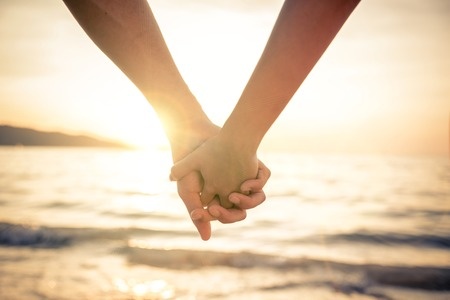 Holding Hands on the Beach