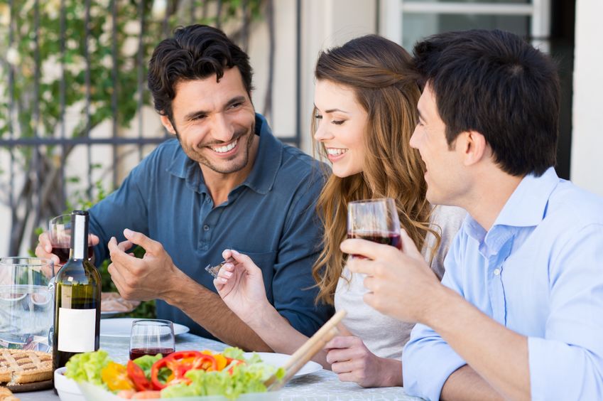 Friends Having Dinner Outdoors