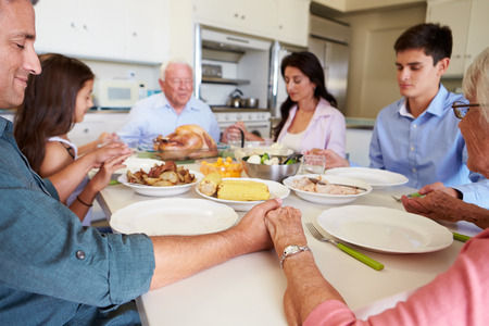 Family Praying Before a Meal