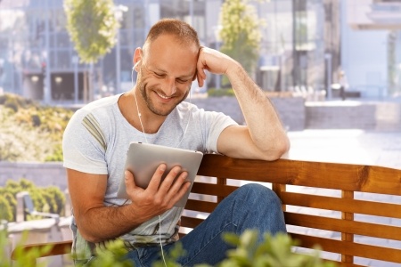 Guy Using Earbuds