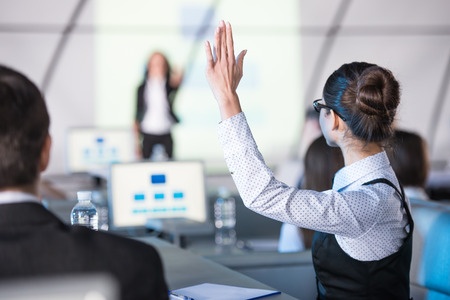 Woman Raises her Hand to Speak