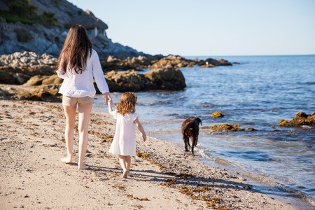 Young Woman and Little Girl on the Beach