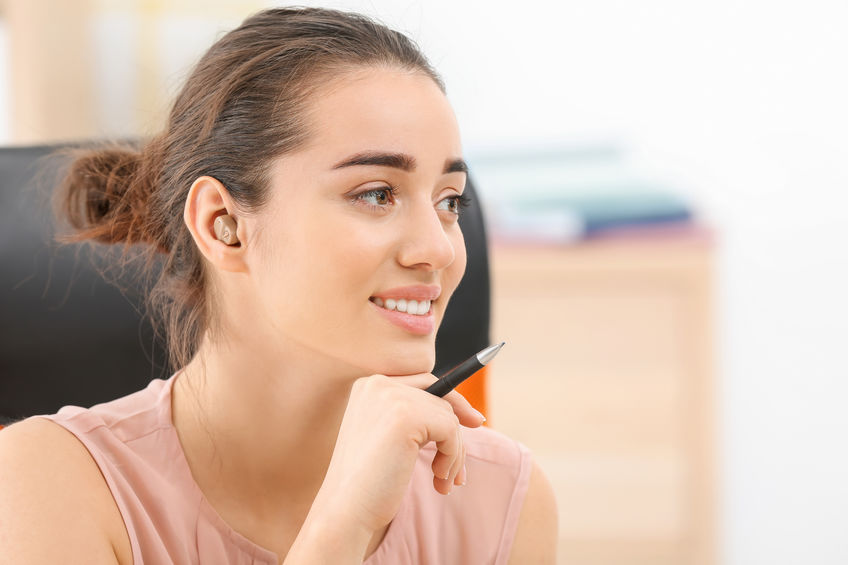 Young Woman with Hearing Aid