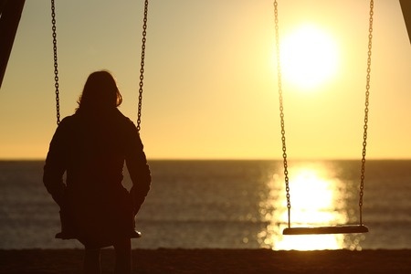 Woman on a Swing at the Beach