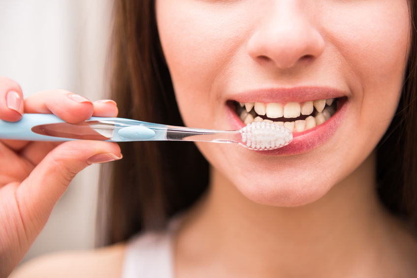 Woman Brushing Her Teeth