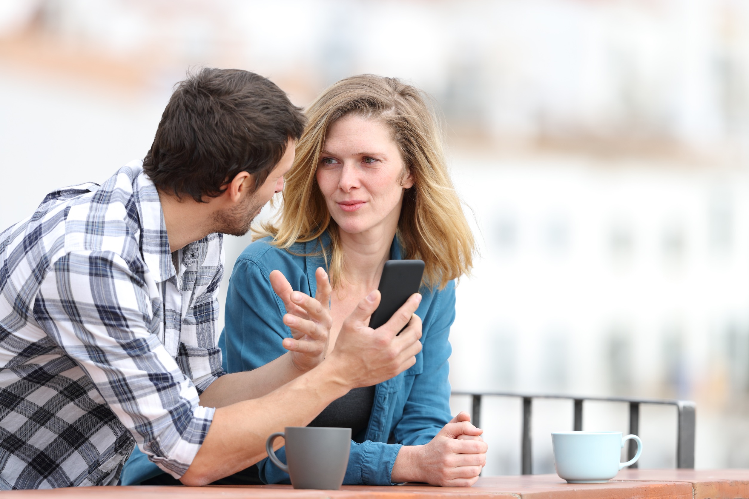 Couple Discussing Phone Content