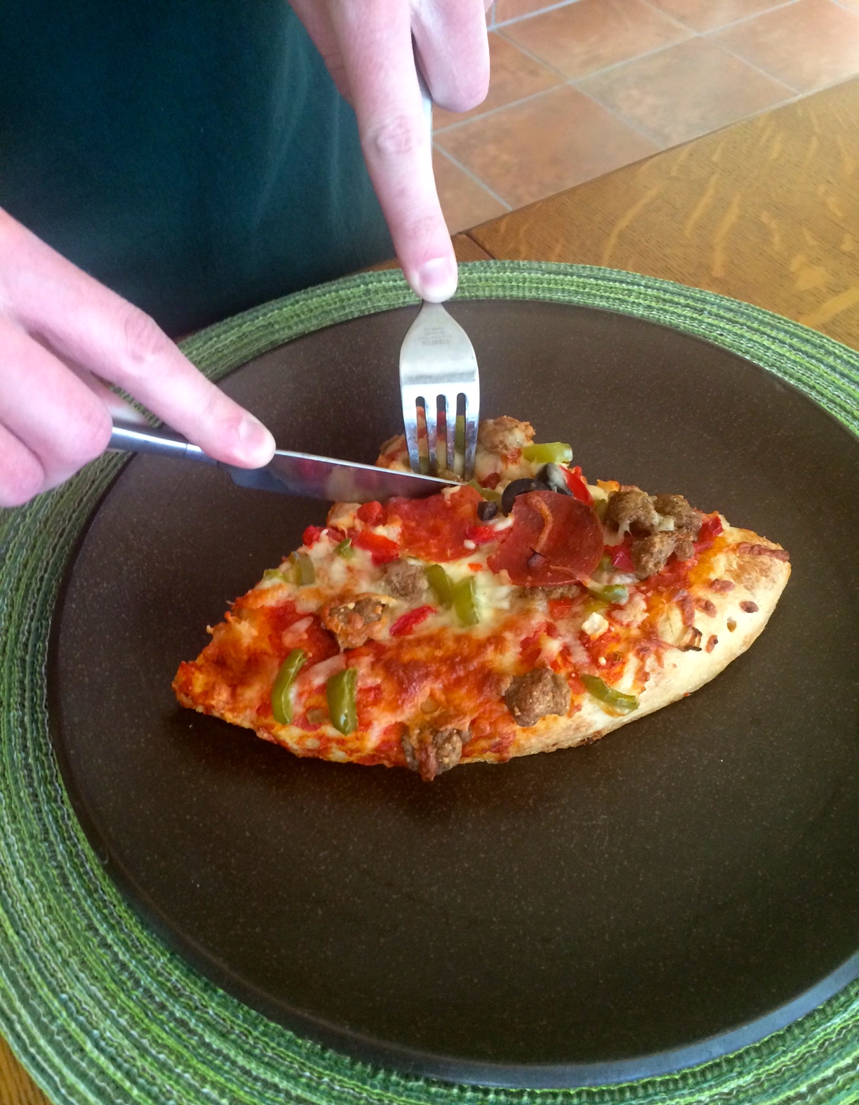 Eating pizza with a knife and fork