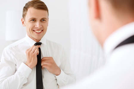 Man Looking in Mirror