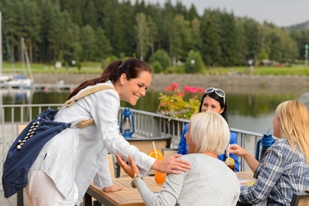 Woman greeting friends