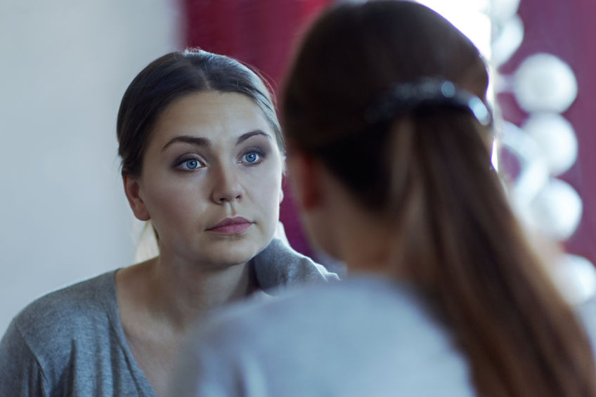 Woman Looking in Mirror